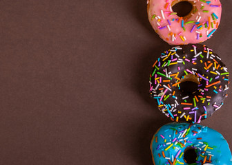 colorful doughnuts brown background studio