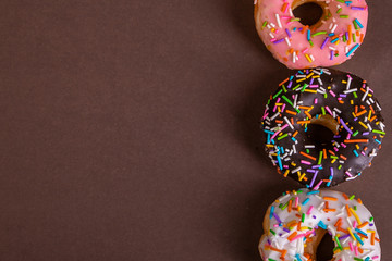colorful doughnuts brown background studio
