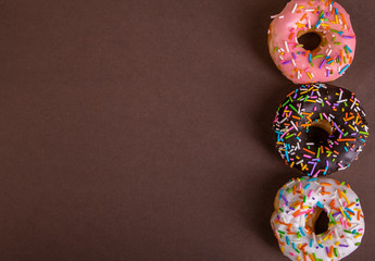 colorful doughnuts brown background studio