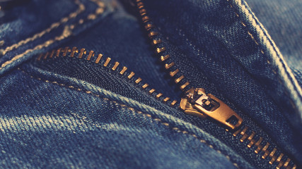 locking zipper on jeans, fashionable and stylish thing, vintage toned © sabdiz