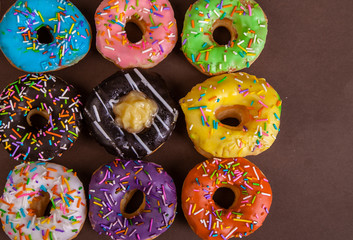 colorful doughnuts brown background studio