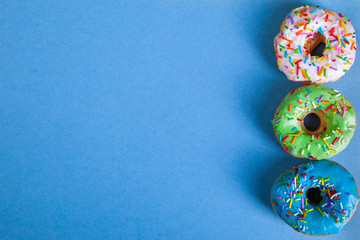 colorful doughnuts blue background studio