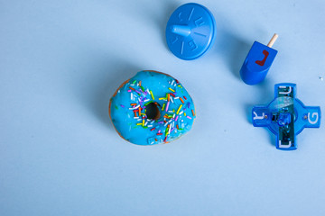 colorful doughnut dreidel blue background studio