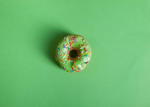 colorful doughnut green background studio