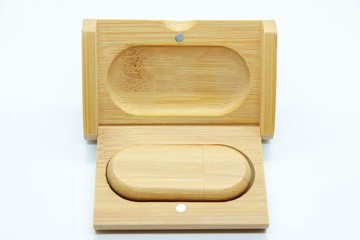 Wooden flash drive located on a white background