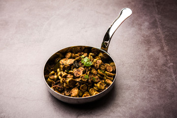 Tendli / Kundroo sabzi or Kovakkai Poriyal also known as ivy gourd, served in a bowl or karahi. selective focus