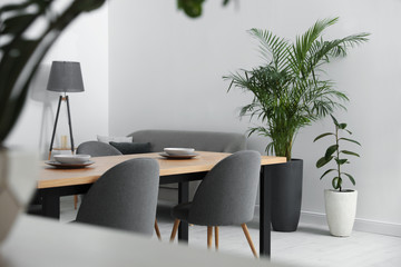 Stylish wooden table in modern room interior