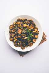 Tendli / Kundroo sabzi or Kovakkai Poriyal also known as ivy gourd, served in a bowl or karahi. selective focus