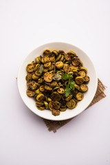 Tendli / Kundroo sabzi or Kovakkai Poriyal also known as ivy gourd, served in a bowl or karahi. selective focus