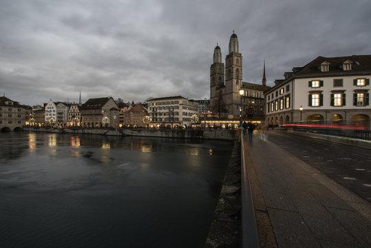 zurich switzerland, old town with the historic buildings and churches on the limmat river in the evening in the christmas time.