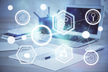 Computer on desktop with social network theme icon. Multi exposure. Concept of international connections.