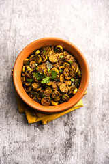 Tendli / Kundroo sabzi or Kovakkai Poriyal also known as ivy gourd, served in a bowl or karahi. selective focus