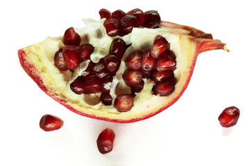 pomegranate with seeds isolated on white