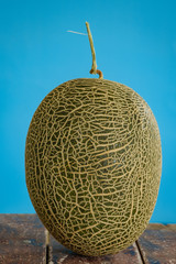 Close-Up Of Melon On Wooden Table