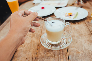 Close-Up Of Hand With Cup Of Coffee