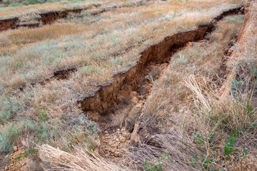 landslide in an environmentally hazardous crack in ground descent of large layers of soil.