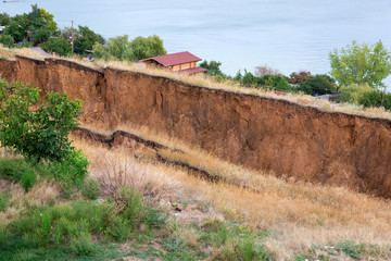 landslide in an environmentally hazardous area large crack in ground descent of large layers of...