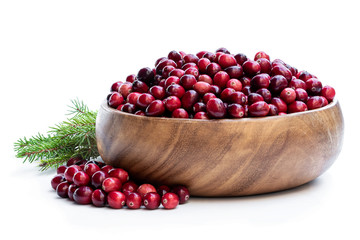 Fresh cranberries in wooden bowl isolated on white