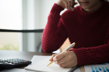 Business woman working in office with documents