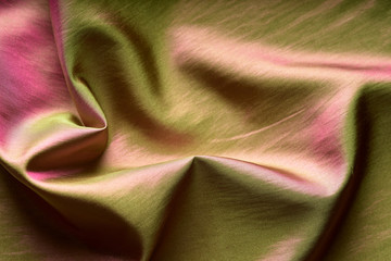 folds on taffeta fabric with color tints, background image