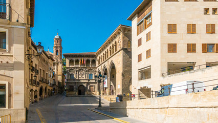 View on central plaza of historic town Alcaniz in Spain during daytime