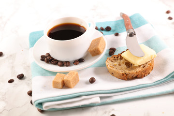 coffee cup and bread with butter