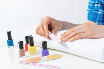 Woman using nail file and create nails shape