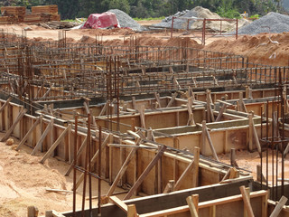 Building ground beam under construction using temporary timber plywood at the site. Reinforced by...