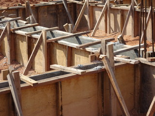 Building ground beam under construction using temporary timber plywood at the site. Reinforced by...