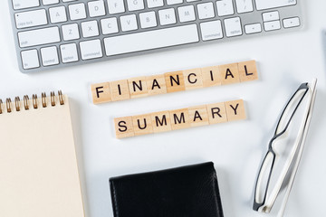 Financial summary concept with letters on cubes