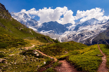 Obraz premium Hiking trail high up in the Pennine Alps near the lake Arpitetta. Ayer, Valais, Switzerland