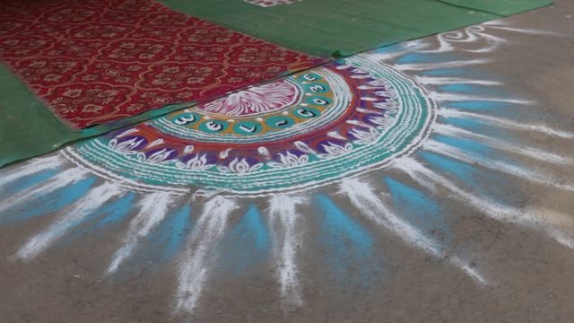 Maharashtrian Wedding - Decorative Flower Rangoli and oil lamp to welcome relatives 