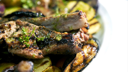 Griled cuisine, with meat and grilled vegetable.