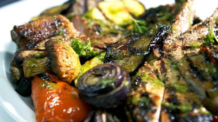Griled cuisine, with meat and grilled vegetable.