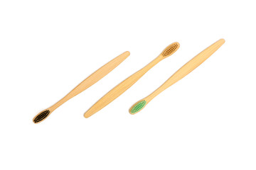 Bamboo toothbrushes on white background.