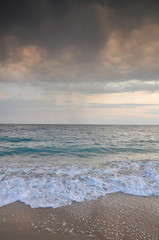 Beautiful sunset on sea during a storm
