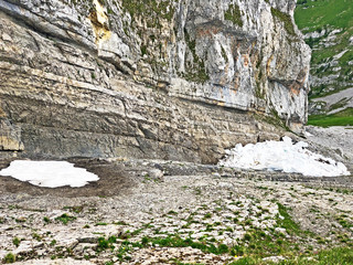 Stones and rocks of the alpine peaks above the Wagital or Waegital valley and mountain lake...