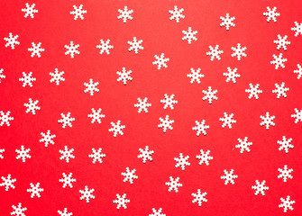 White decorative snowflakes on a red background for signature and design.