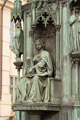neo-gothic statue of woman holding book