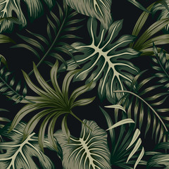 Tropical green palm leaves floral seamless pattern black background. Exotic jungle wallpaper.