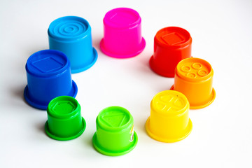 Eight multi-colored molds of different sizes