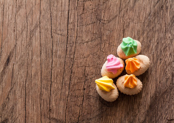 colorful cookies on wood background