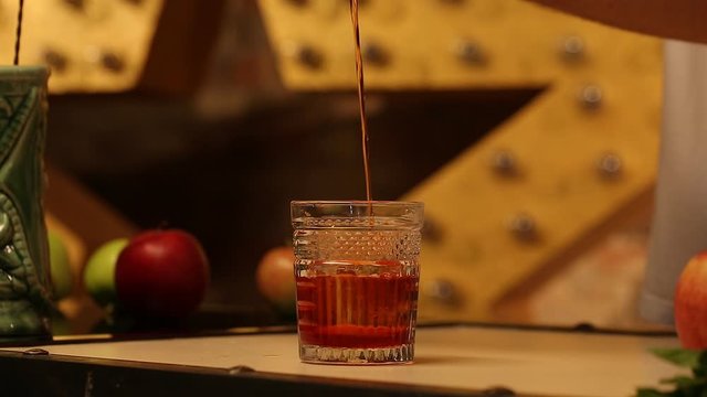 The bartender macking alcoholic cocktail