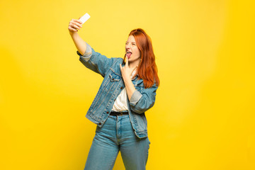 It's easier to be follower. Need minimum clothes for selfie. Caucasian woman's portrait on yellow...