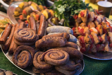 Street food at the fair homemade grilled sausages