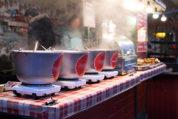 Street food is brewed mulled wine in vats