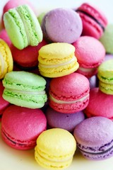Colorful macarons cakes. Small French cakes. Top view. Pastel colors. Pastry, bakery and branding concept.