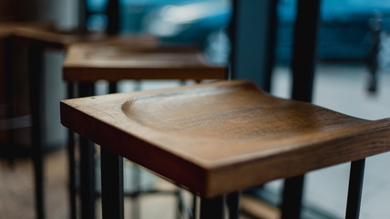 Wooden chair in the cafe in the big city near the window and street view