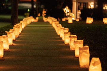 Candle lit residential sidewalk on Christmas Eve
