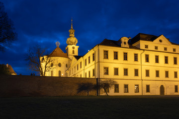 Fototapeta na wymiar Night view of Brevnov monatery in Prague, Czech Republic. Benedictine Archabbey of St Adalbert and St Margaret was founded in 993 AD